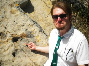 Acrocanthosaurus foot print with my hand for scale. I am a ring size men’s 7.5.